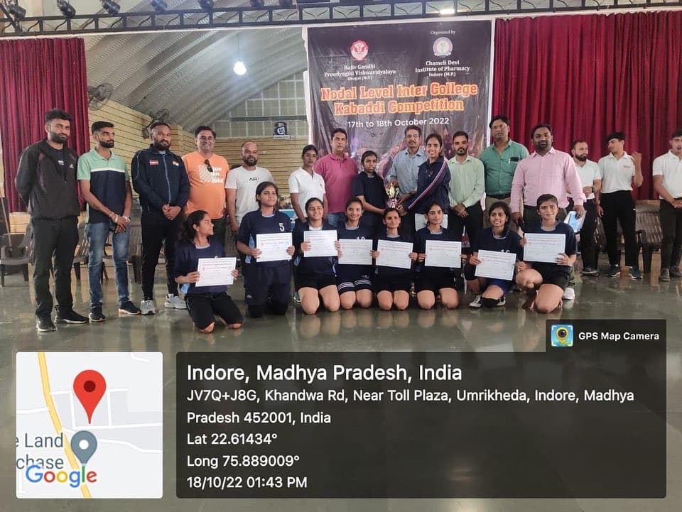 CDGI Girls Kabaddi Team celebrating on stage with the tournament coordinators and coaches.