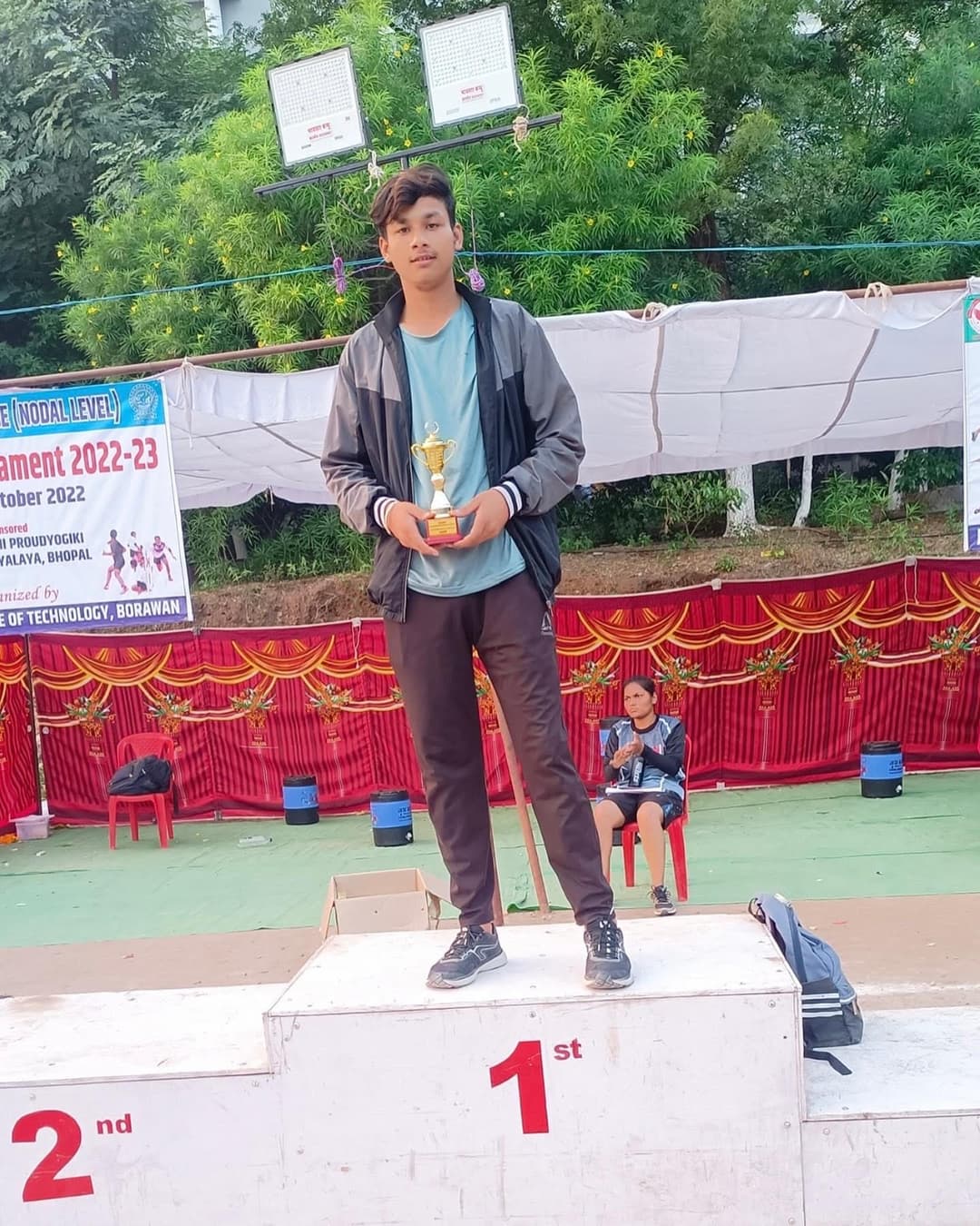 Student receiving the 1st place award at RGPV Inter-College Athletics Meet.