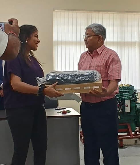 Ms. Pankhudi Agrawal (CSE) receiving the Cummins Scholarship laptop award.