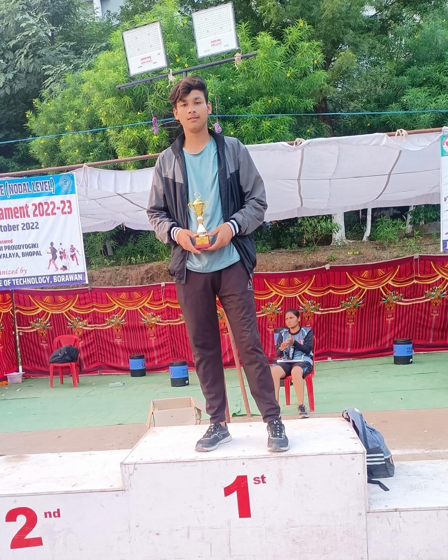 Student receiving the 1st place award at RGPV Inter-College Athletics Meet.