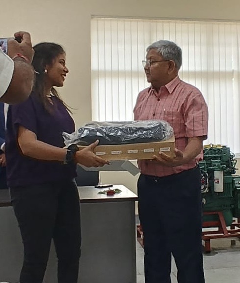 Ms. Pankhudi Agrawal (CSE) receiving the Cummins Scholarship laptop award.